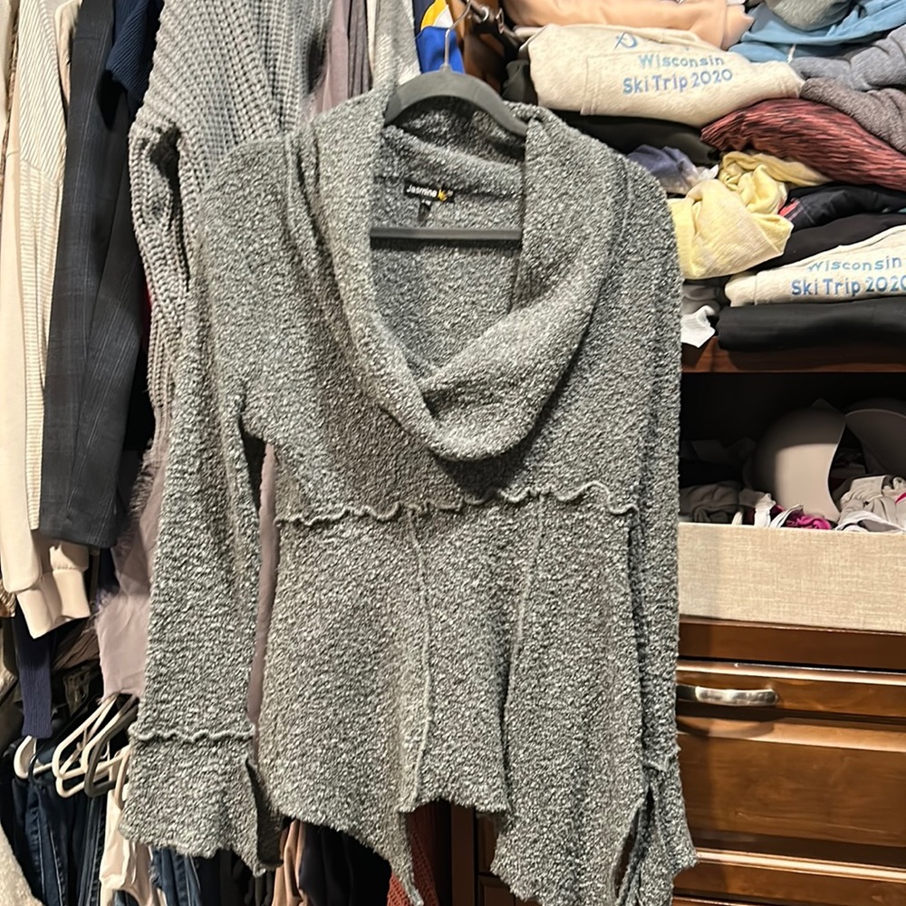Asymmetrical sweater with bell cuffs.  Size L